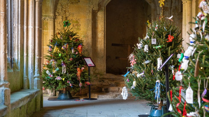 Decorated Christmas trees in the Cloister at Lacock
